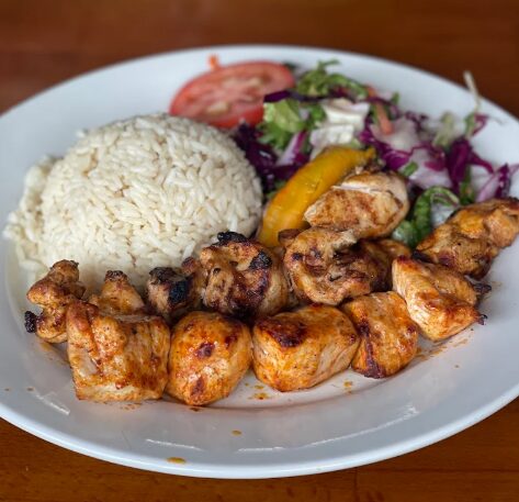 Charcoal-grilled chicken kebab with rice and salad at Grand Sahara